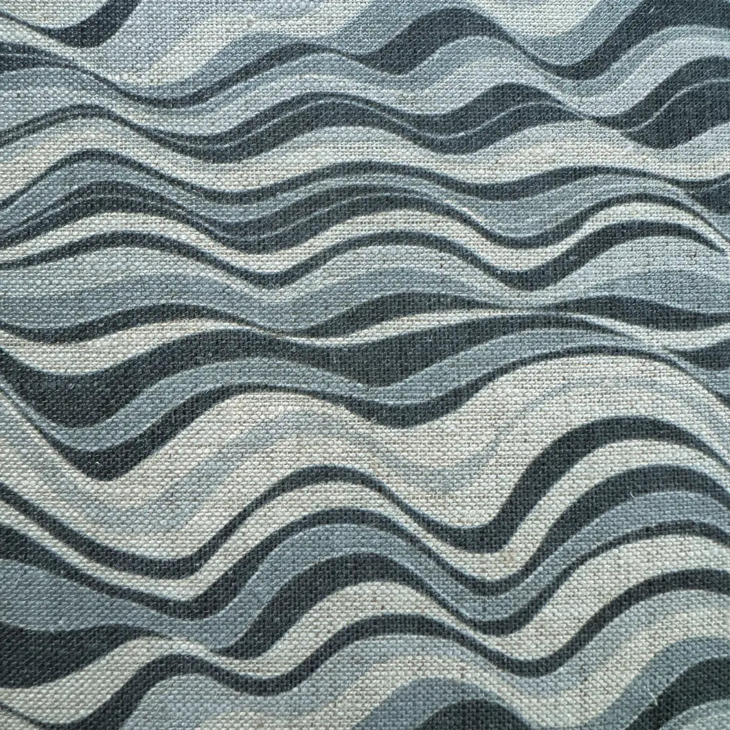 Close-up of the Frenchmans Straddie Stripe blue wave pattern printed on textured linen.
