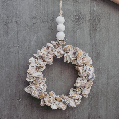Handcrafted oyster shell wreath in white, pearl, soft purple and burnt orange with ceramic beads