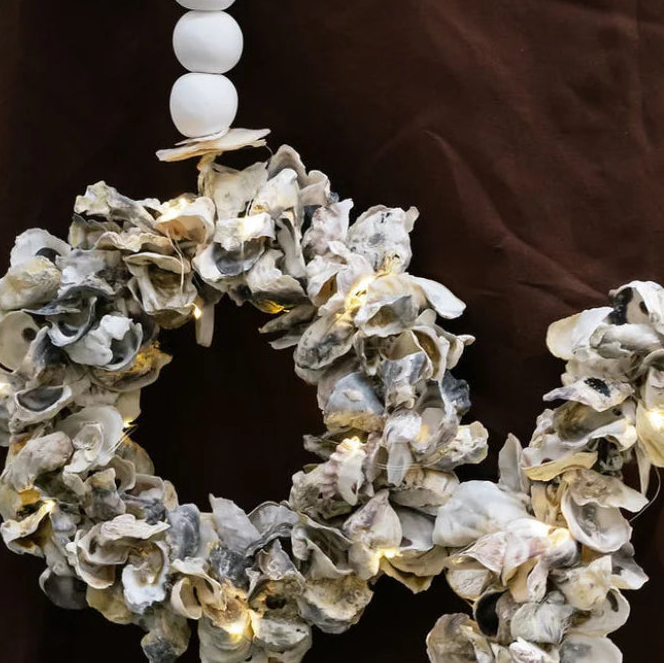 Handcrafted oyster shell wreath in white, pearl, soft purple and burnt orange with ceramic beads