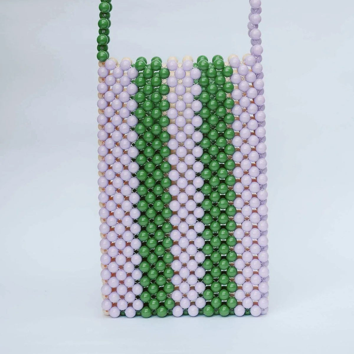 Beaded pouch with green, white, and pink stripes on a light gray background