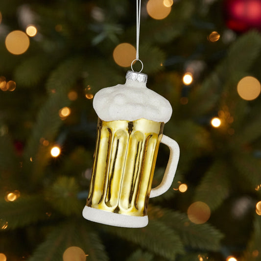 Beer glass Christmas ornament hanging on a Christmas tree
