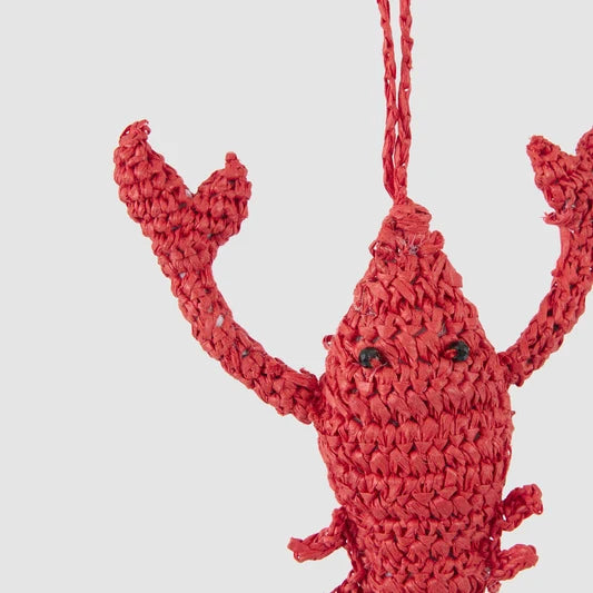 Close-up of the crochet lobster Christmas decoration