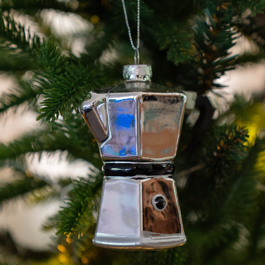 Glass coffee percolator Christmas ornament hanging on a Christmas tree