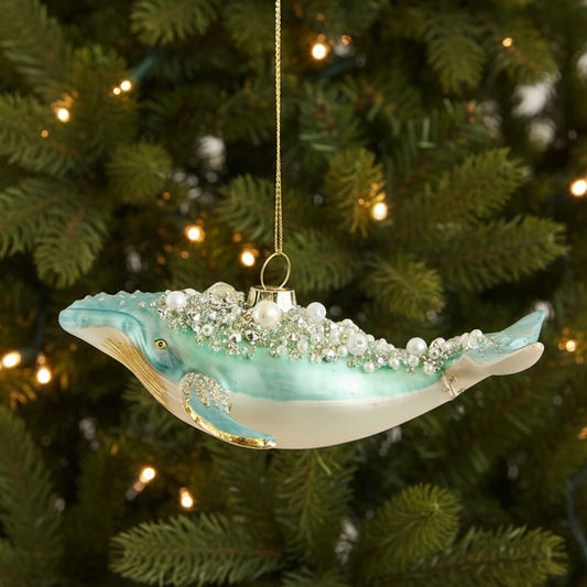 Glass whale Christmas decoration hanging on a Christmas tree