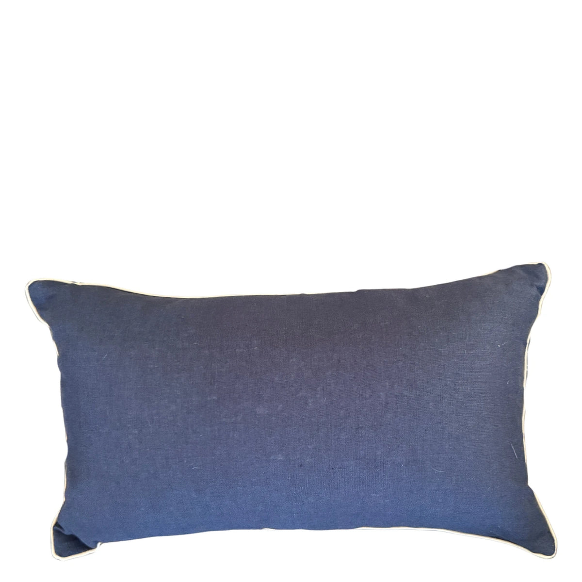 Navy linen reverse of rectangular Pacific Growth Rings cushion cover with natural piping