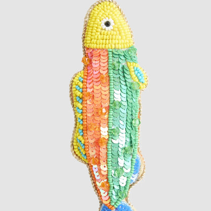 Close-up of the rainbow beaded fish Christmas ornament